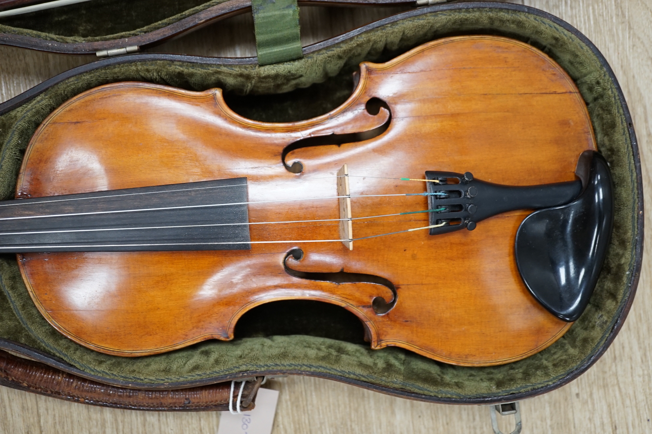 An early 19th century cased Italian violin labelled Florentus Florenus, body length 35cm, with a French silver mounted bow stamped Cuniot Hury, both in a fine Hill style case CITES Submission reference 6VGB2X83